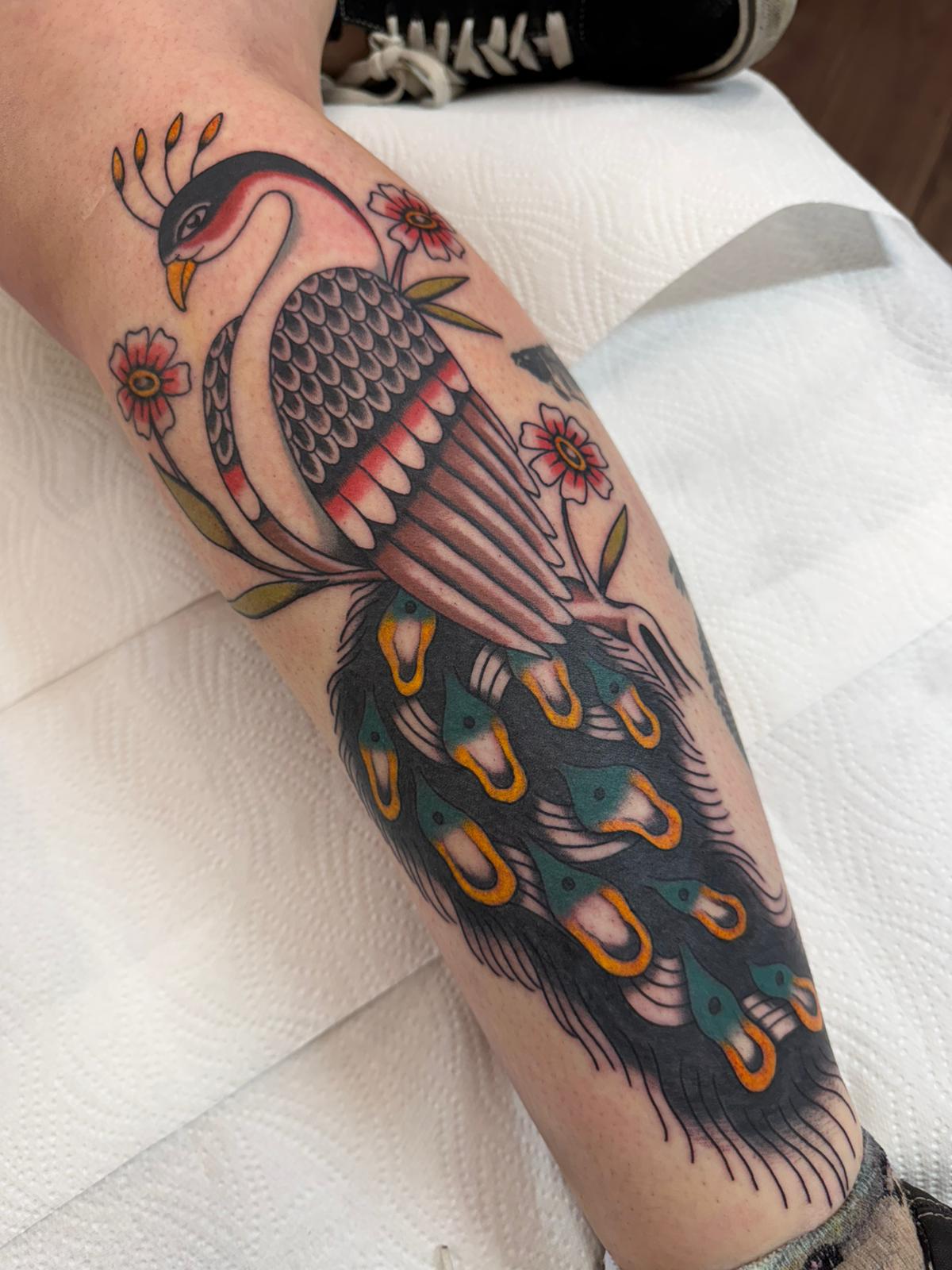 Peacock tattoo by Robin